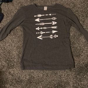 I am selling a gray 3 quarter sleeved shirt with bow and arrows on it.